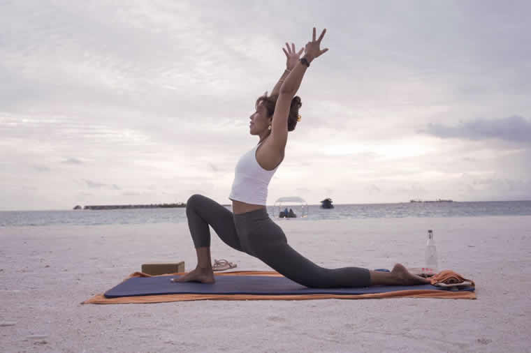 yoga on the beach in maldives