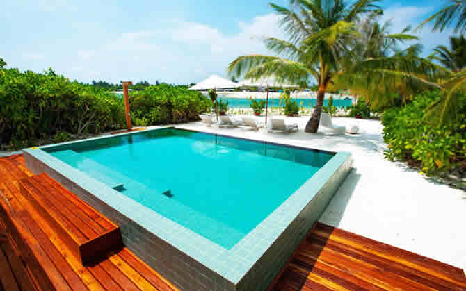 a three-bedroom beach pool villa in maldives