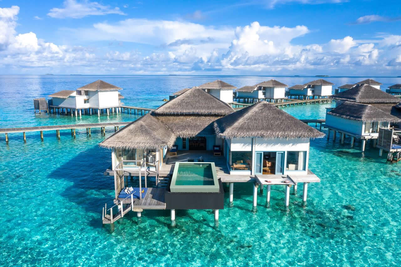 Raffles Maldives Meradhoo - sunset over-water pool villa